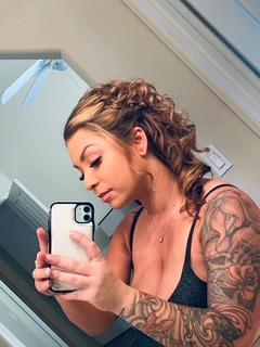 Post-service selfie — tousled curls and soft glam.