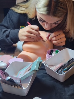Lash extension training on a mannequin at Skin Lab classes.