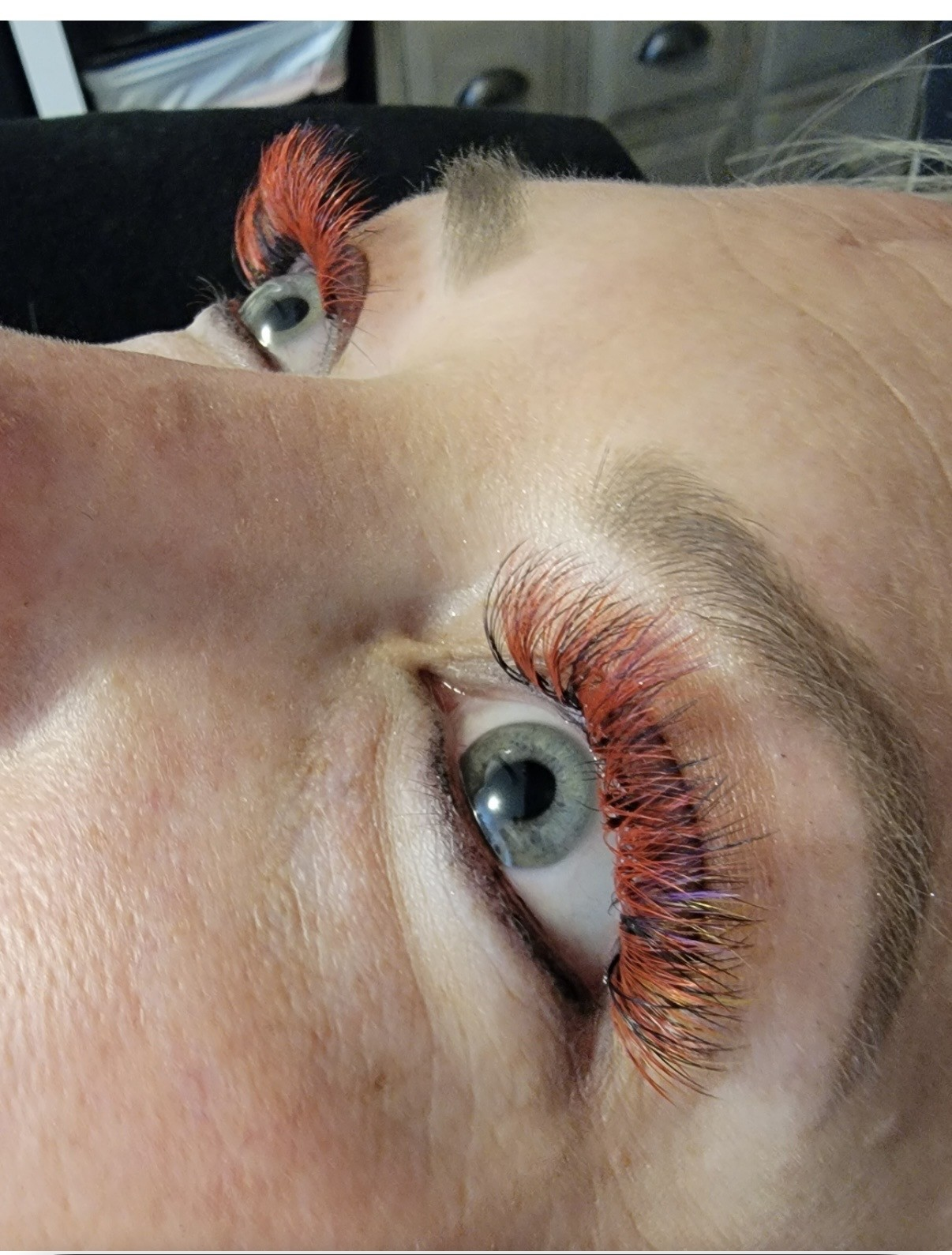 Vivid orange color lash extension set — statement lashes at Skin Lab.