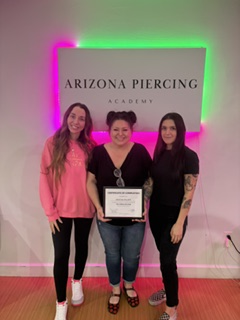 Arizona Piercing Academy graduate with Cristina after certification.