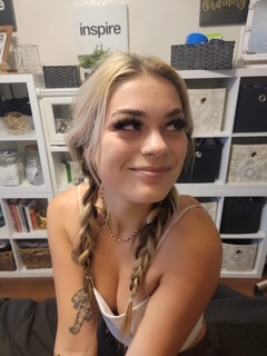 Client smiling after a full lash and glam session.
