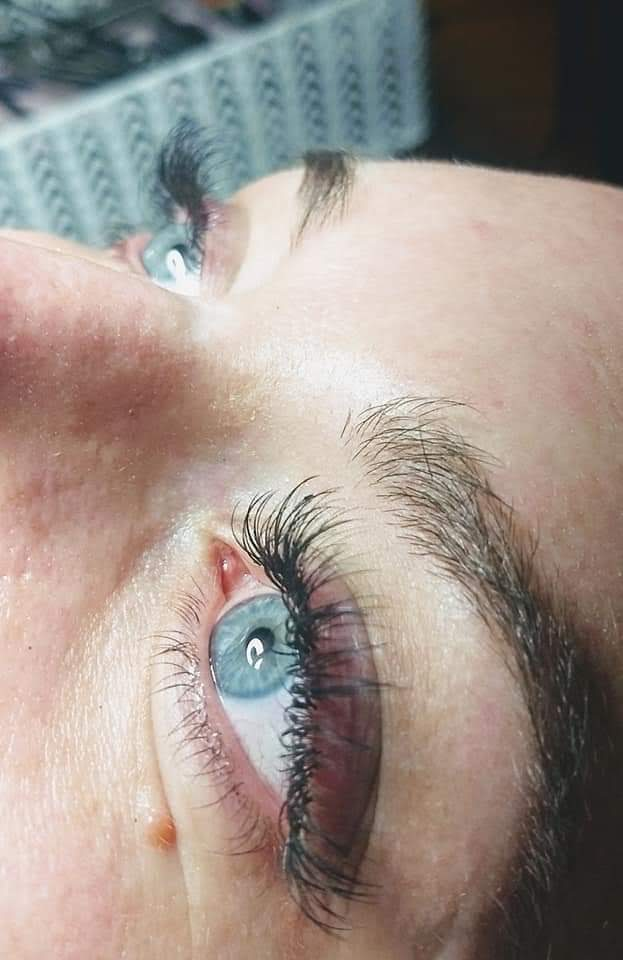 Custom volume lash set on a client with blue eyes.